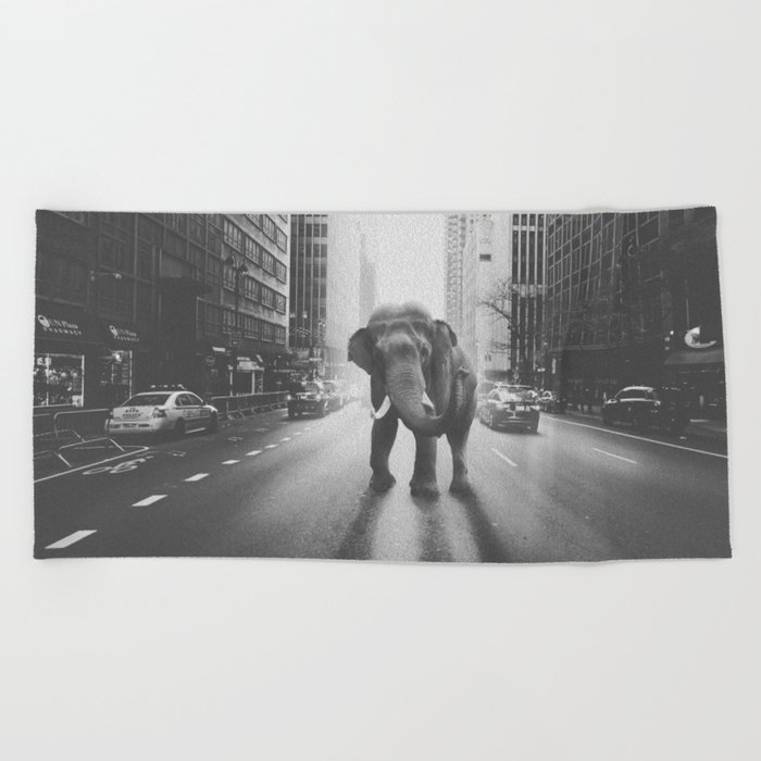 Elephant in the city Beach Towel