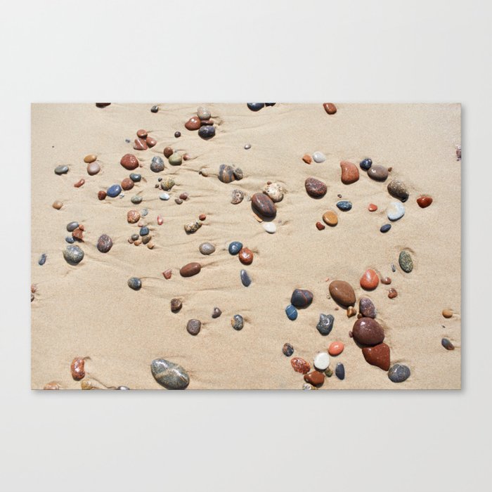 Wet sand and stones on beach Canvas Print