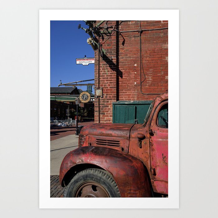 Classic car and old winery building in Distillery area in Toronto city Art Print