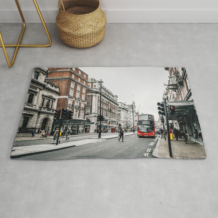 Red bus in Piccadilly street in London Rug