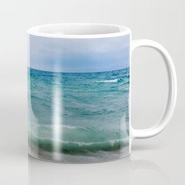 Strong waves crash over the beach Beautiful seascape. Coffee Mug