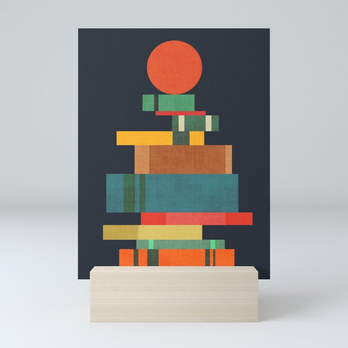 Book stack with a ball Mini Art Print