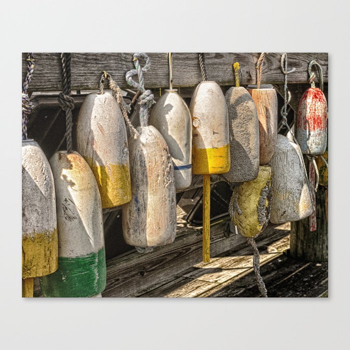 Old buoys at the dock Canvas Print