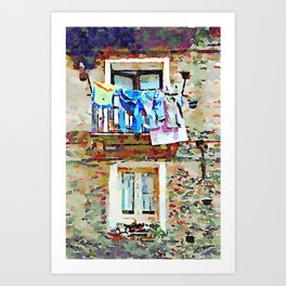 Two windows with balcony and hanging clothes Art Print