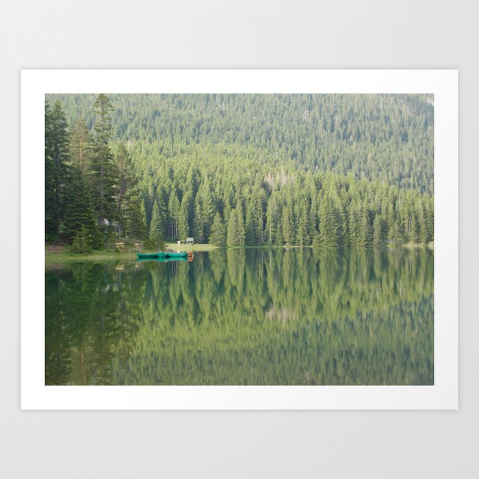 Green water reflection with a boat Art Print