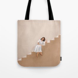 Girl Thinking on a Stairway Tote Bag