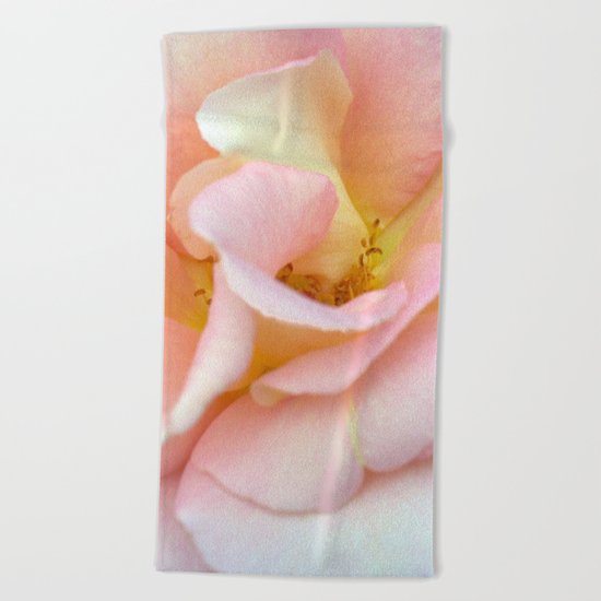the source Beach Towel