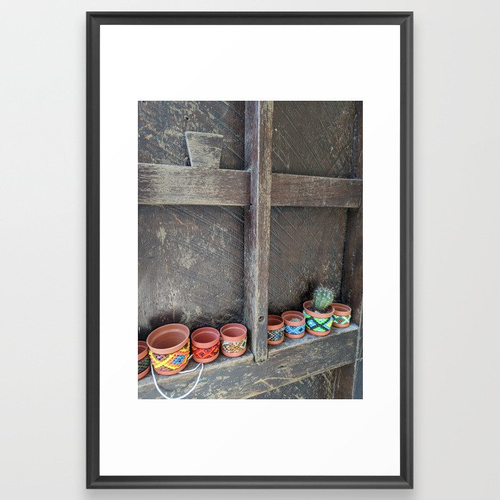 Rustic window with colorful mini flowerpots Framed Art Print