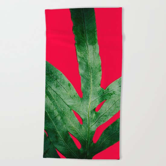 Green Fern on Bright Red Beach Towel