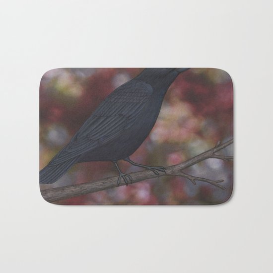 crow on a branch bokeh Bath Mat