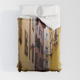 Narrow color street full of vibrant color houses in Italy Duvet Cover