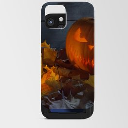 Spooky Jack O Lantern Among Dried Leaves on Wooden Fence iPhone Card Case