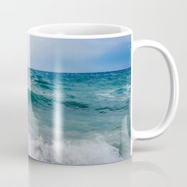Strong waves crash over the beach Beautiful seascape. Coffee Mug