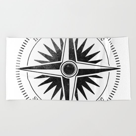 Black Compass on White Beach Towel