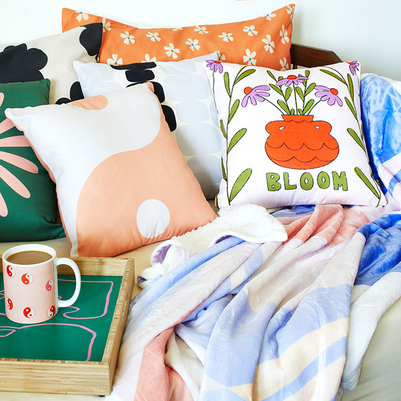 assortment of pillows on a day bed