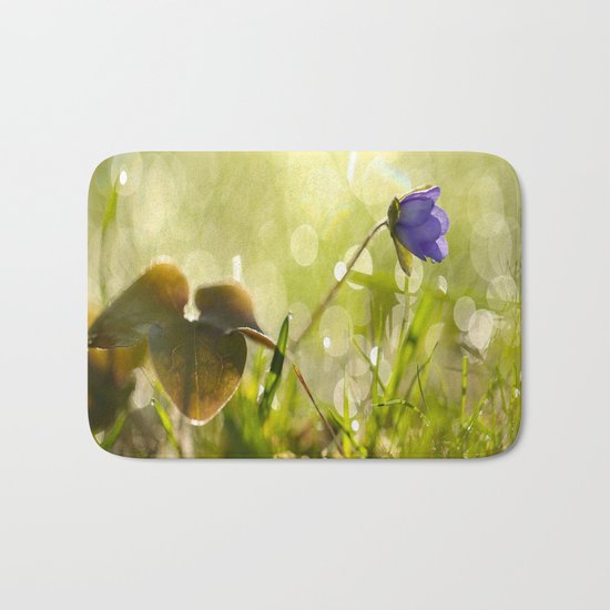 Beautiful spring - first flower little anemone with beautiful bokeh in green background Bath Mat