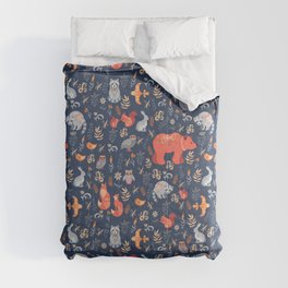 Fairy-tale forest. Fox, bear, raccoon, owls, rabbits, flowers and herbs on a blue background. Seamle Comforter