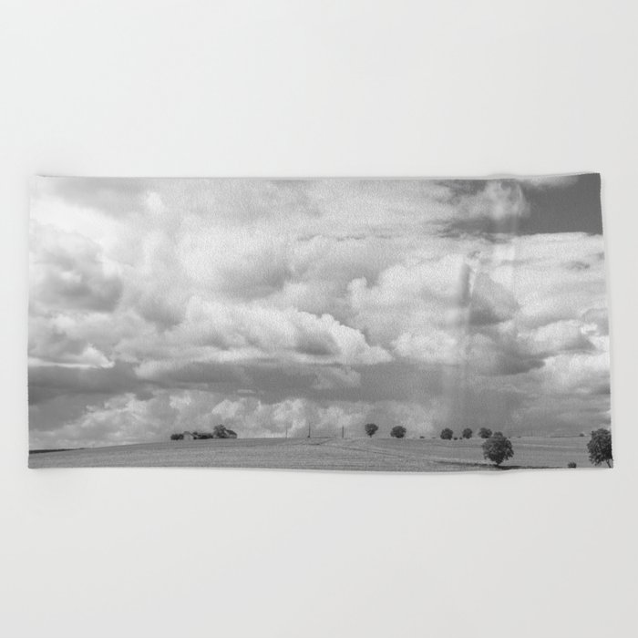Dark black and white clouds over a Tuscan landscape art print - Italy nature and travel photography Beach Towel
