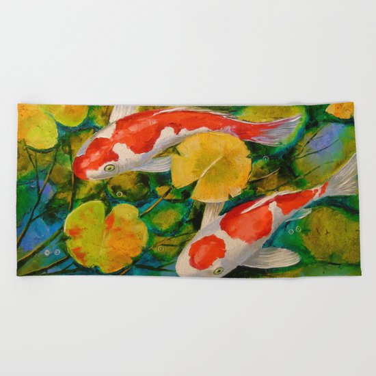 Koi in a pond Beach Towel