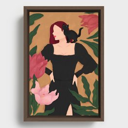 Woman in black with meow Framed Canvas