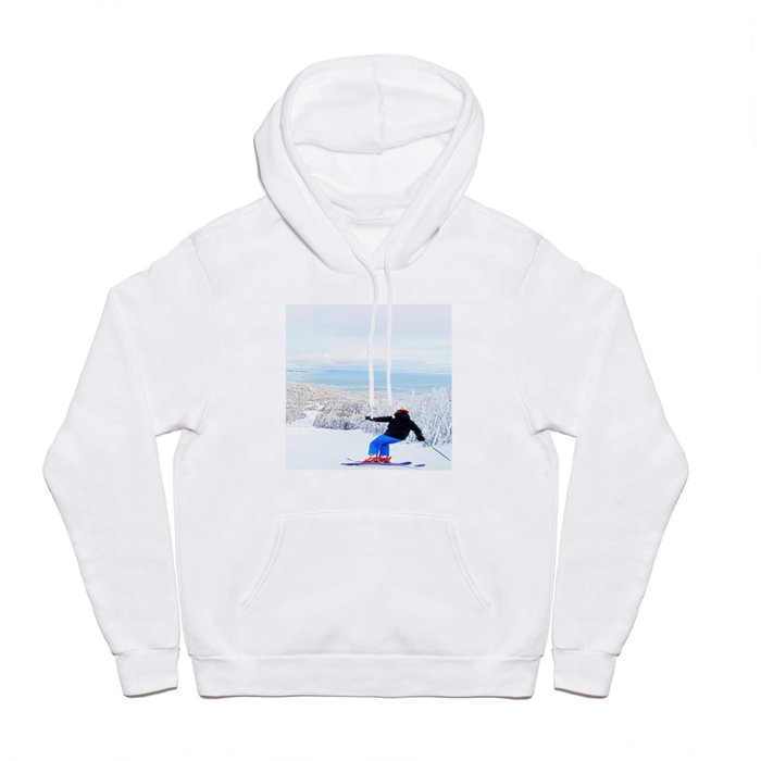 Skier at a ski resort with snowy mountain and lake Hoody