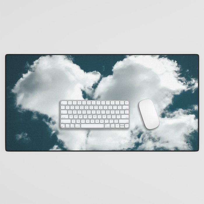 Broken heart shaped cloud in blue sky Desk Mat
