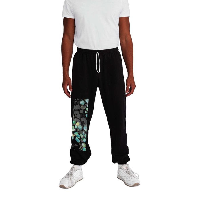 Juicy deep print of watercolor eucalyptus with sophisticated green sprigs. Shades of green, turquoise and emerald with delicate elements of transparency and gold. Sweatpants