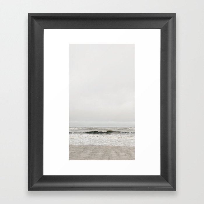 Cloudy beach Framed Art Print