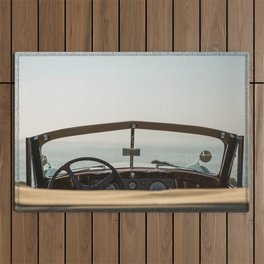 Classic car and ocean Outdoor Rug