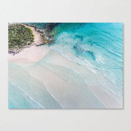Aerial seascape photography of vibrant blue ocean with shallow waves on the beach Canvas Print
