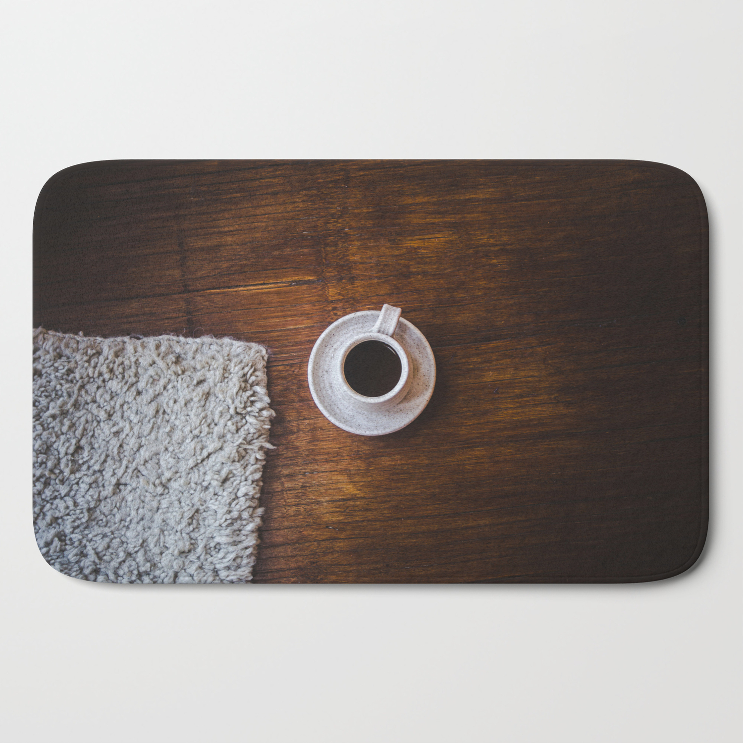Flatlay Brown Wood Floor And Cup Of Dark Coffee Next To Wool Mat Bath Mat By Laurensquirephotography Society6