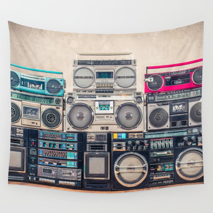 Retro old school design ghetto blaster stereo radio cassette tape recorders boombox tower from circa 1980s front concrete wall background. Vintage style filtered photo Wall Tapestry