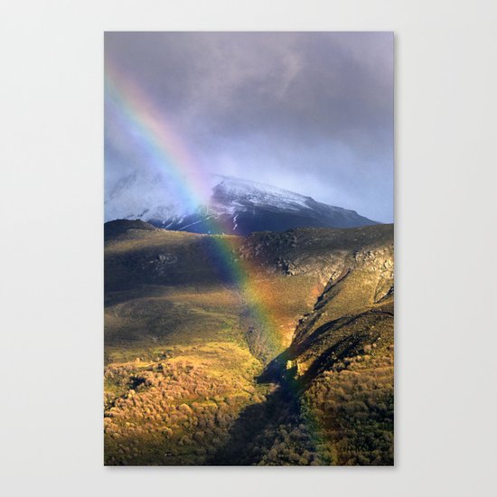 "Rainbow through the snow mountains". Into the storm. Canvas Print