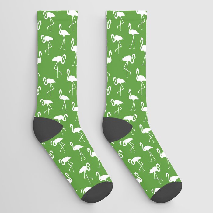 White flamingo silhouettes seamless pattern on green background Socks