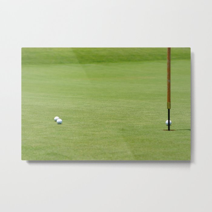Golf balls near flagstick Metal Print