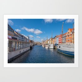 Nyhavn Canal under a blue sky with some clouds Art Print
