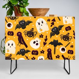 Colourful Orange Halloween Seamless Pattern with Cute Spider, Crow and Ghost Characters Credenza