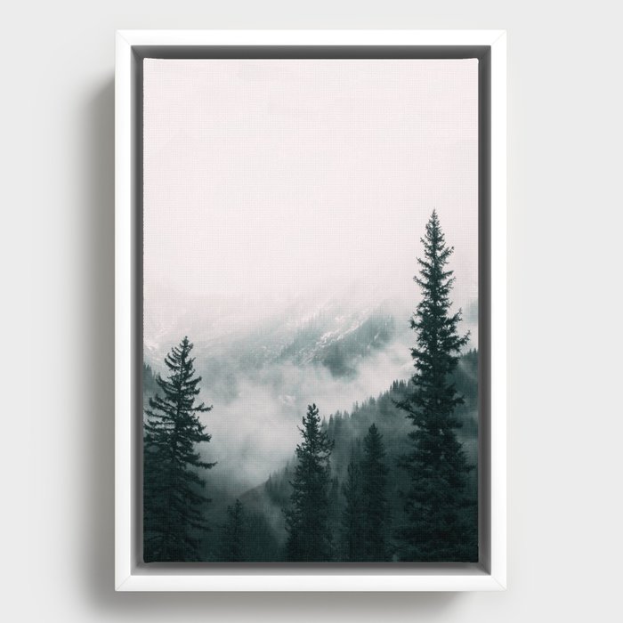 Forest mist beneath the mountain peaks Framed Canvas