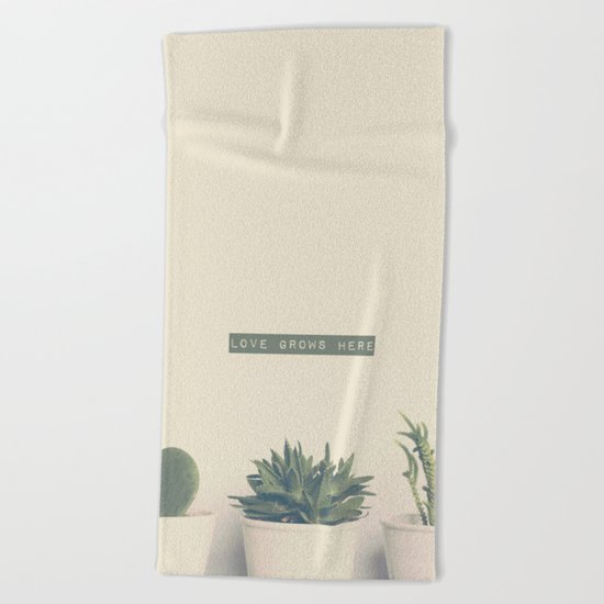 love grows here Beach Towel