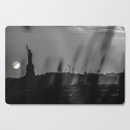 The Statue of Liberty at sunset in New York City black and white Cutting Board