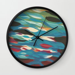 reflected sky in a waters ripple Wall Clock