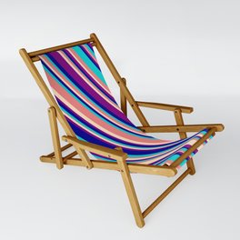 [ Thumbnail: Light Coral, Bisque, Purple, Dark Blue, and Dark Turquoise Colored Lined/Striped Pattern Sling Chair ]