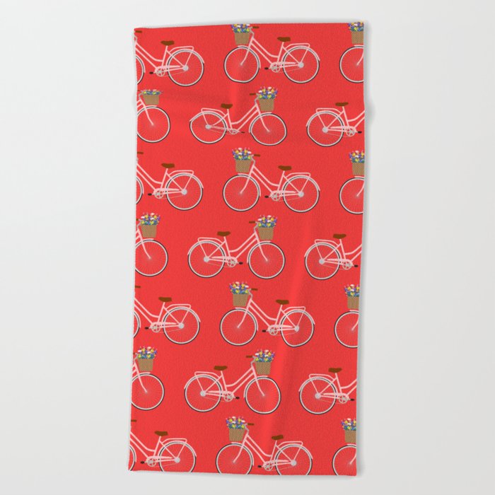 Bicycle with flower basket on red Beach Towel