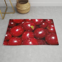 Vintage cherry harvested in a vegetable garden in a saucepan Rug