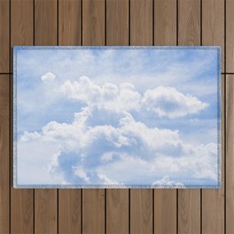White Clouds in a Bright Blue Sky Outdoor Rug