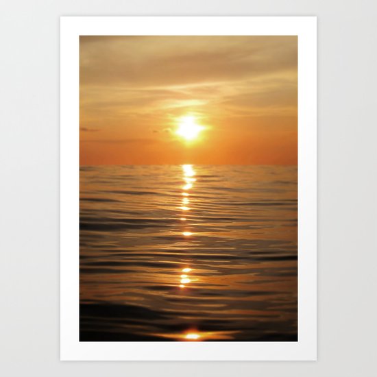 Sun setting over calm waters Art Print