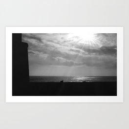 Catatonic - cat sunning itself on a warm seawall in rays of morning sunlight black and white landscape photographic print Art Print