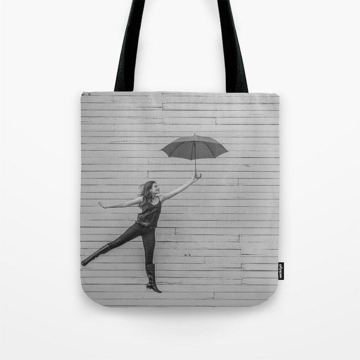 On the way to the break of day; woman flying with umbrella confidence inspirational female black and white photograph - photography - photographs Tote Bag