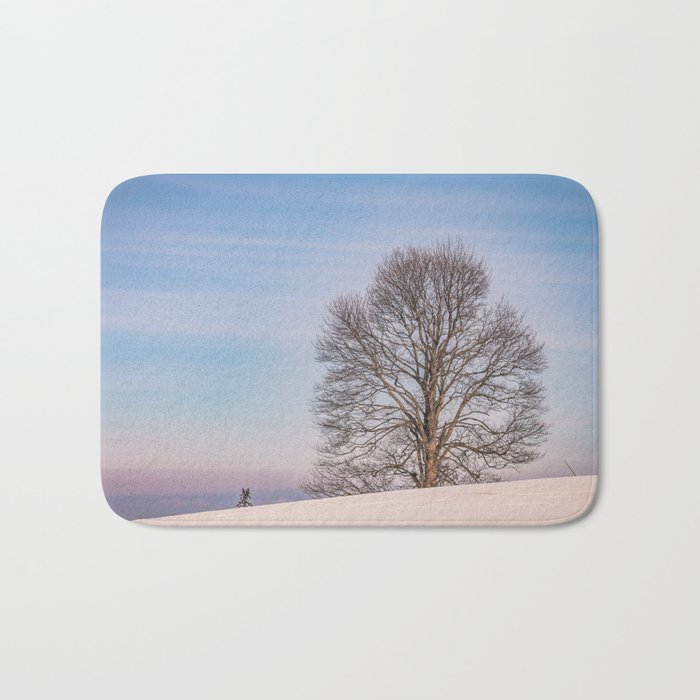 The lonely tree on a winter day Bath Mat