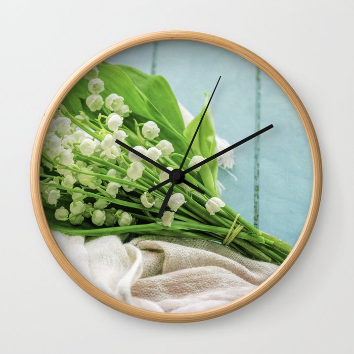 a bunch of lily of the valley Wall Clock
